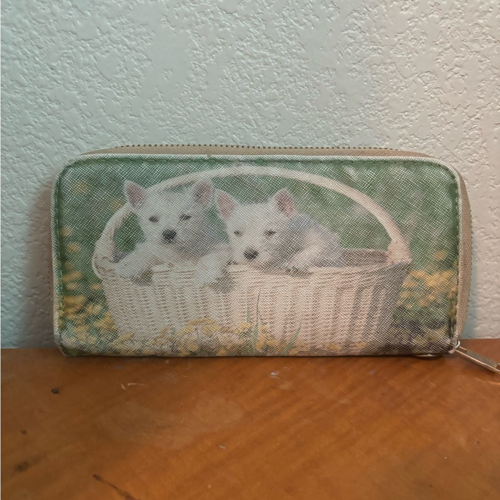 Faux leather zipper wallet. Puppies in a basket on the front and back